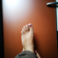 Why should you not sleep with your feet facing the door?